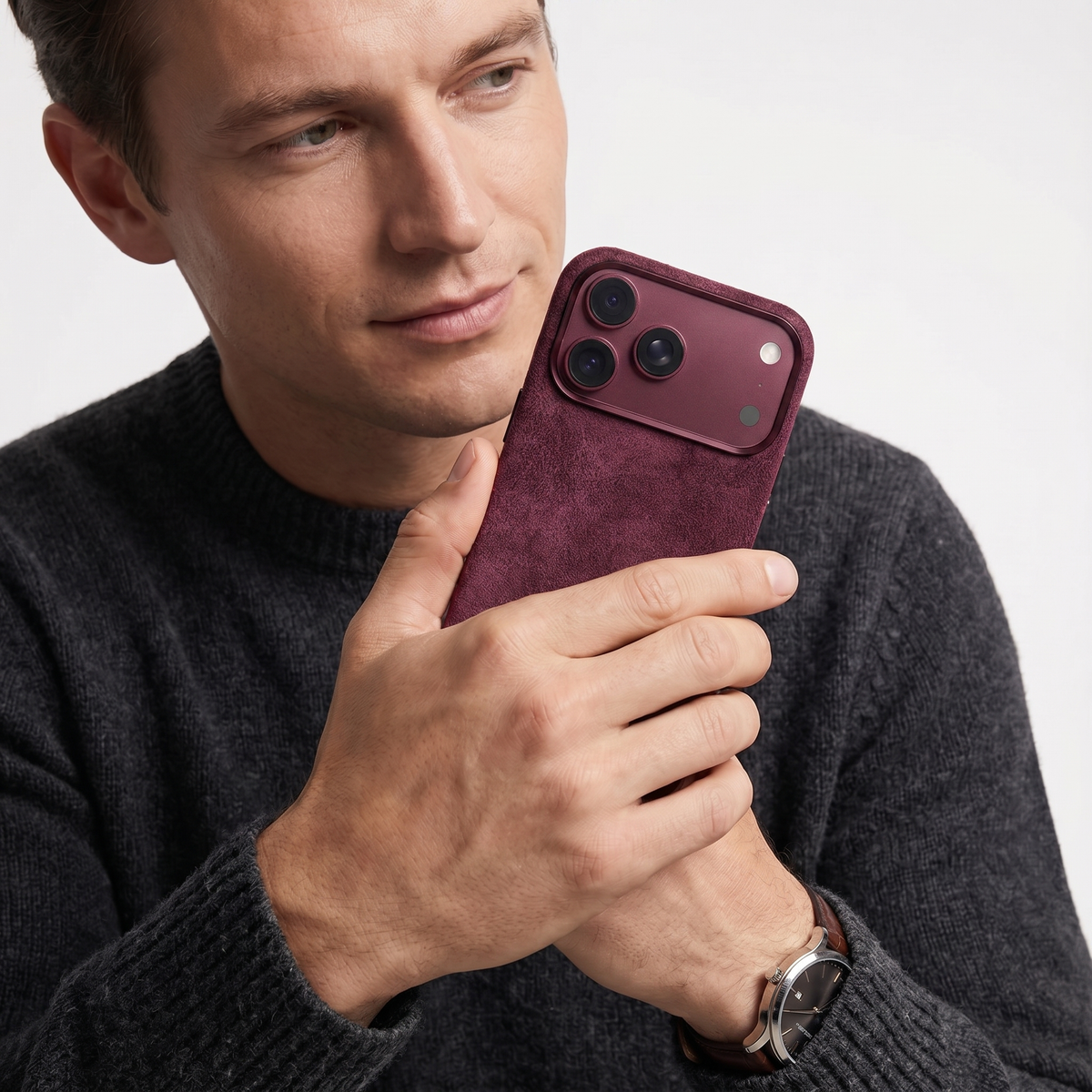Wine Red Alcantara case for iPhone 18 Pro Max held in hands