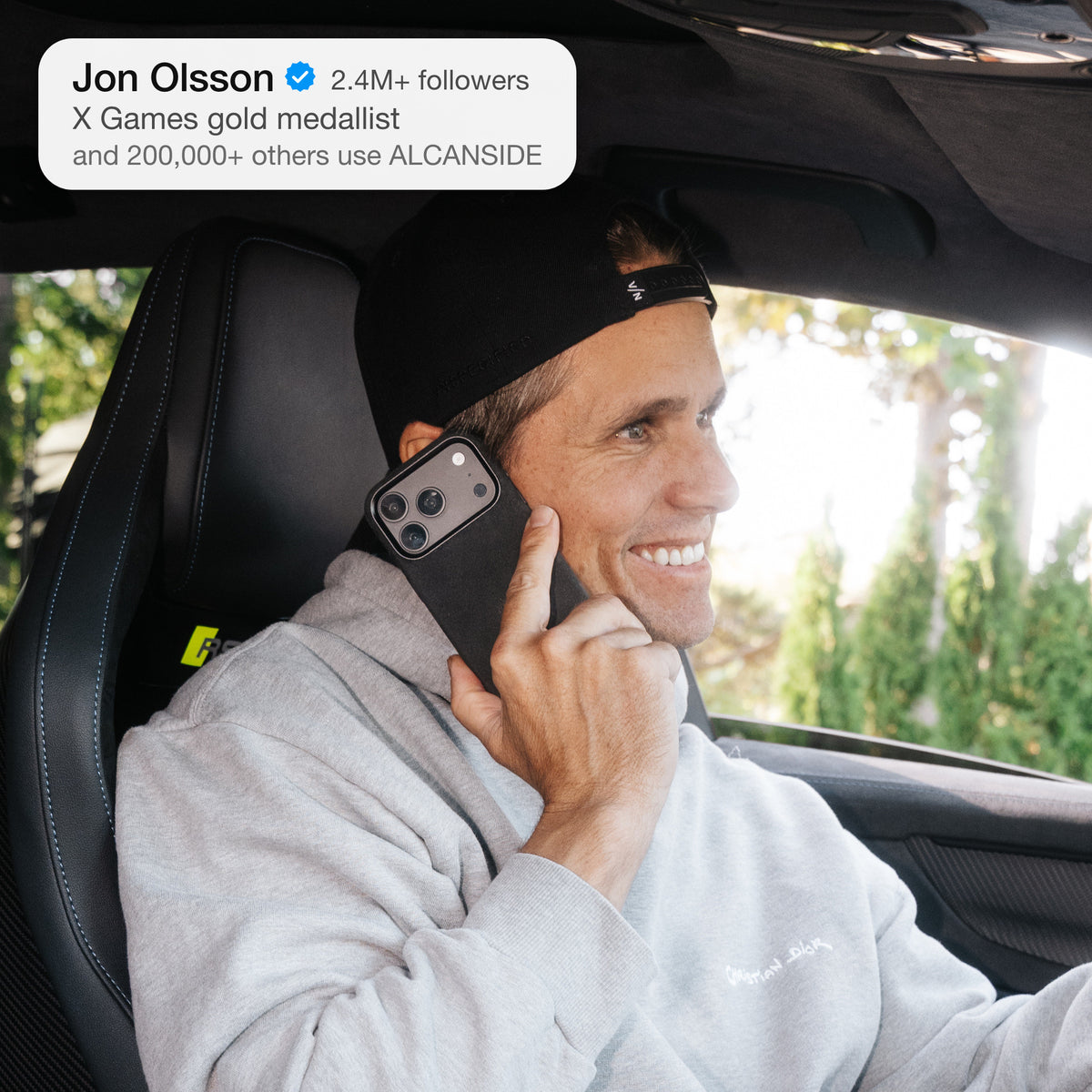 Jon Olsson on the phone in his Audi RS6 with the Deep Black Alcantara case for iPhone 18 Pro